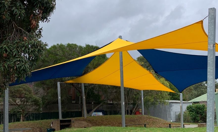 School Shade Sails - Yellow and Blue Shade Sails over a learning area